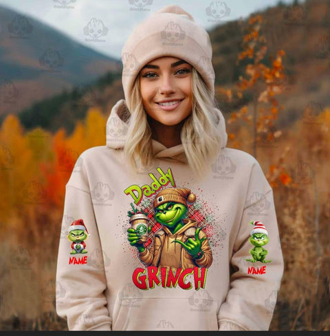 Momma & Daddy Grinch hoodies with Kid names on sleeves.